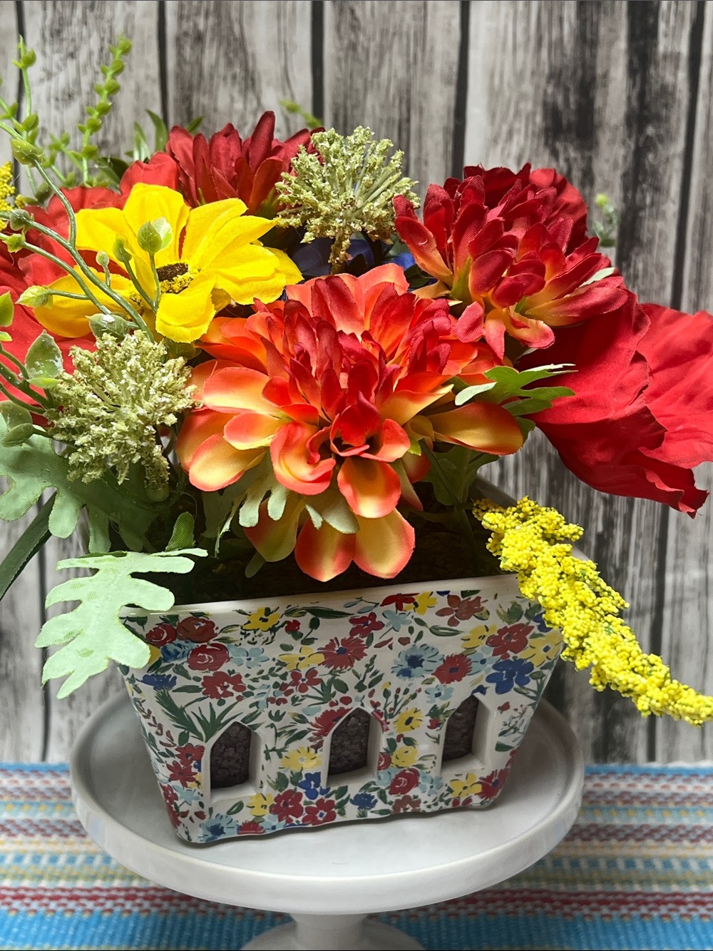 Pioneer Woman Ceramic Berry planter with red and yellow floral arrangement